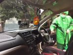 GRAB Laksanakan Penyemprotan Disinfektan Pada Kendaraan Mitra Pengemudi Di Kota Bandung