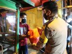 Baksos Serentak, Polresta Bandung Bagikan 1.500 Paket Sembako Kepada PKL Di Masa PPKM Darurat